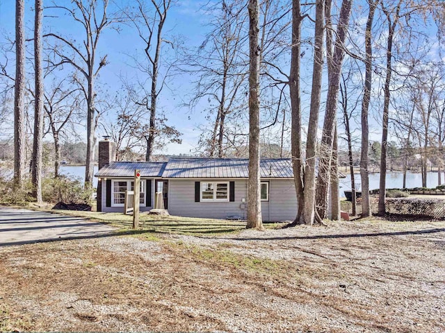 single story home featuring a water view