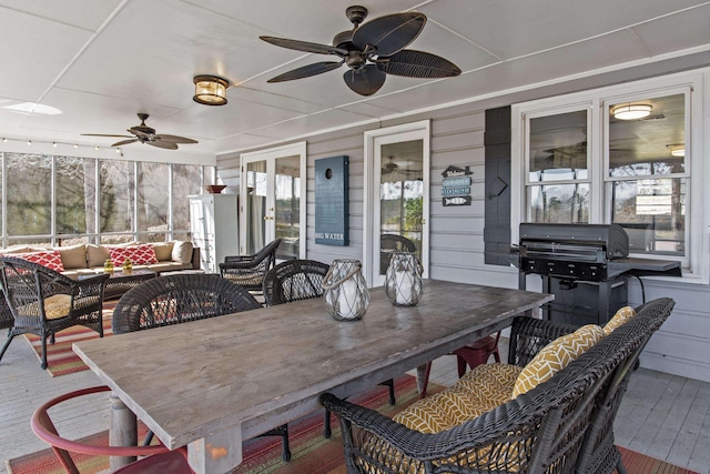 sunroom / solarium with ceiling fan