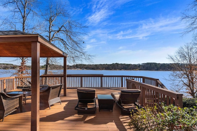 wooden deck featuring a water view