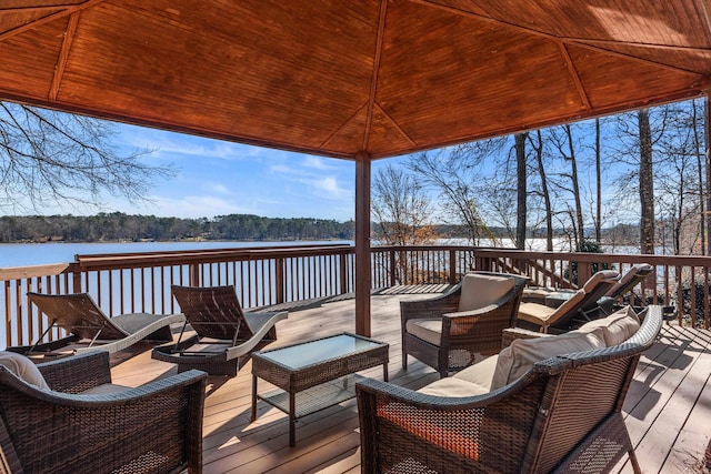 wooden deck with a water view