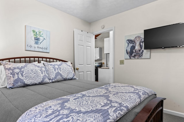 carpeted bedroom with baseboards