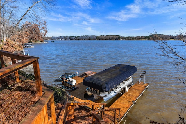 dock area with a water view and boat lift