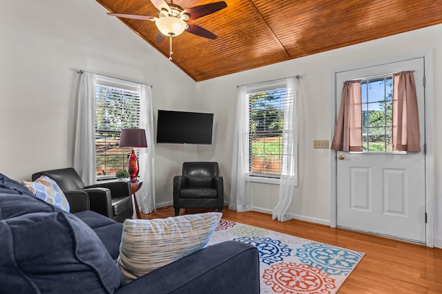 living room with baseboards, wooden ceiling, ceiling fan, vaulted ceiling, and light wood-style floors