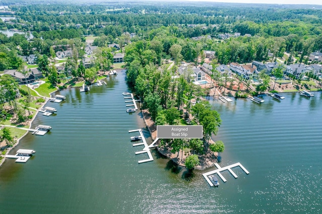 aerial view featuring a residential view, a water view, and a forest view