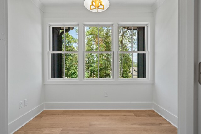 empty room featuring light wood-style floors and baseboards