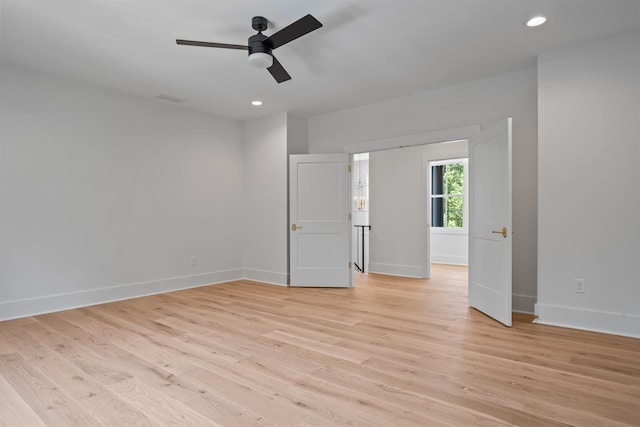 unfurnished room featuring ceiling fan, recessed lighting, visible vents, baseboards, and light wood finished floors