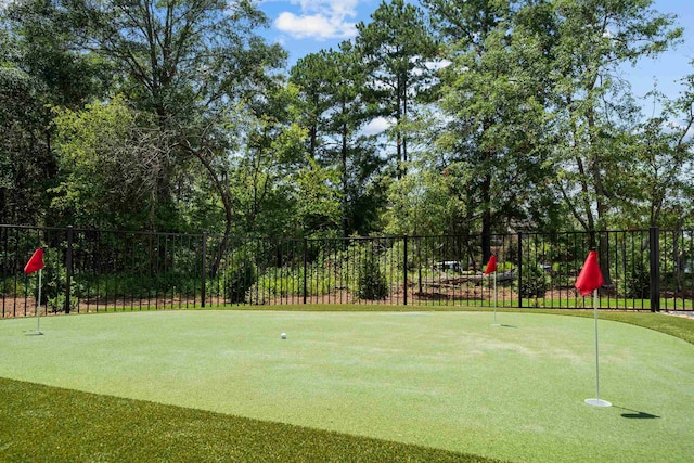 view of home's community featuring fence