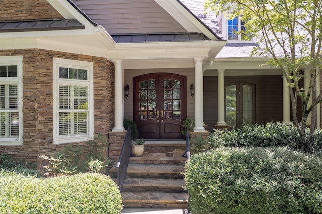 1320 Dejarnet Pl, Greensboro, GA 30642 - doorway to property with a standing seam roof, french doors, stone siding, and a metal roof
