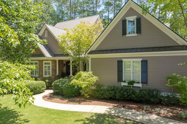 1320 Dejarnet Pl, Greensboro, GA 30642 - craftsman-style house featuring a standing seam roof, a metal roof, and a front yard