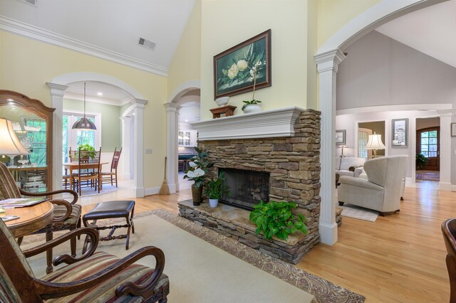 1320 Dejarnet Pl, Greensboro, GA 30642 - living area with ornate columns, high vaulted ceiling, light wood finished floors, and plenty of natural light