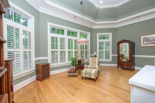 1320 Dejarnet Pl, Greensboro, GA 30642 - living area with wood finished floors, crown molding, a tray ceiling, and recessed lighting