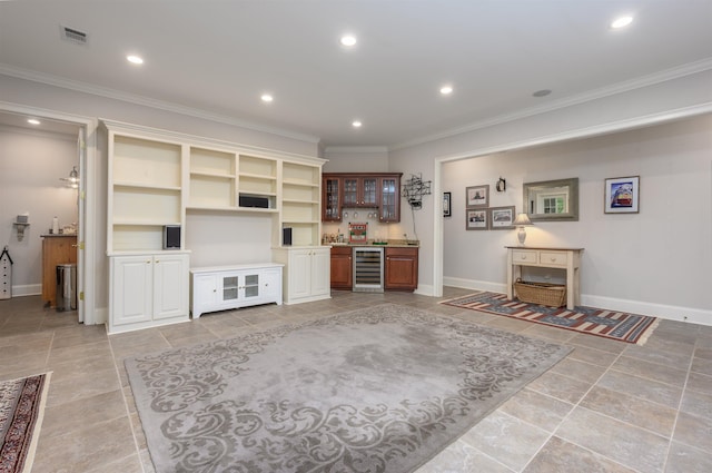 1320 Dejarnet Pl, Greensboro, GA 30642 - living area featuring wine cooler, bar with sink, crown molding, and recessed lighting