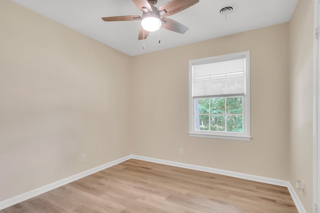 empty room featuring light hardwood / wood-style flooring and ceiling fan