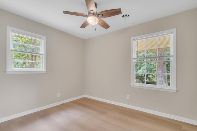 spare room with ceiling fan and light hardwood / wood-style flooring