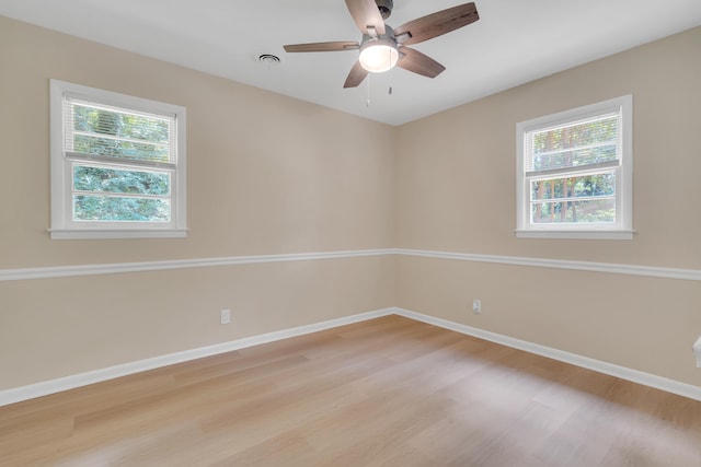 spare room with ceiling fan and light hardwood / wood-style floors