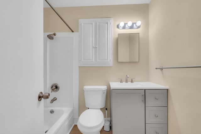 full bathroom featuring vanity, washtub / shower combination, and toilet