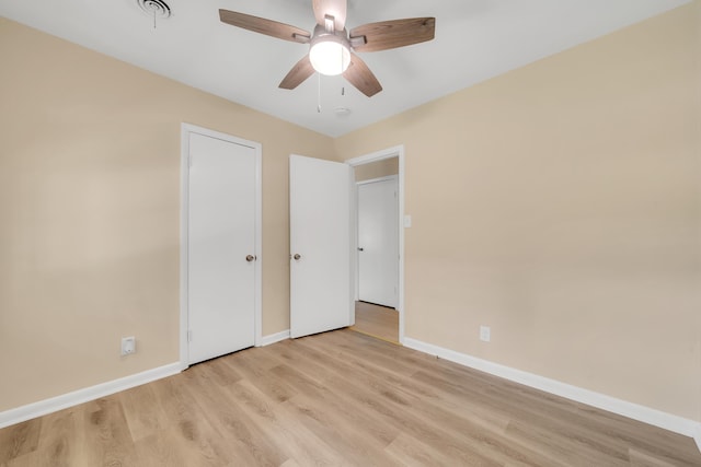 unfurnished bedroom with ceiling fan and light hardwood / wood-style floors