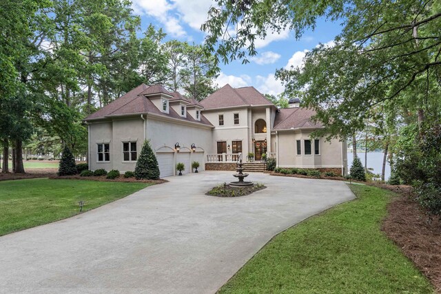 view of front of house with a garage and a front yard