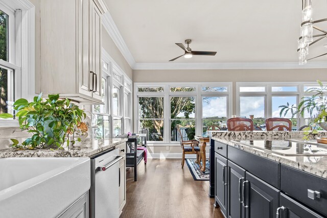 kitchen with dark hardwood / wood-style floors, decorative light fixtures, stainless steel dishwasher, black electric stovetop, and crown molding