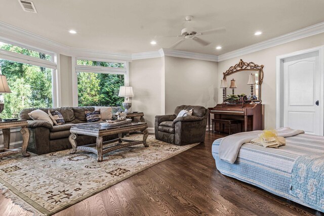 interior space featuring ornamental molding, dark wood-type flooring, and ceiling fan