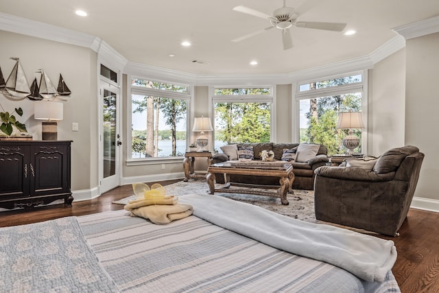 sunroom featuring ceiling fan