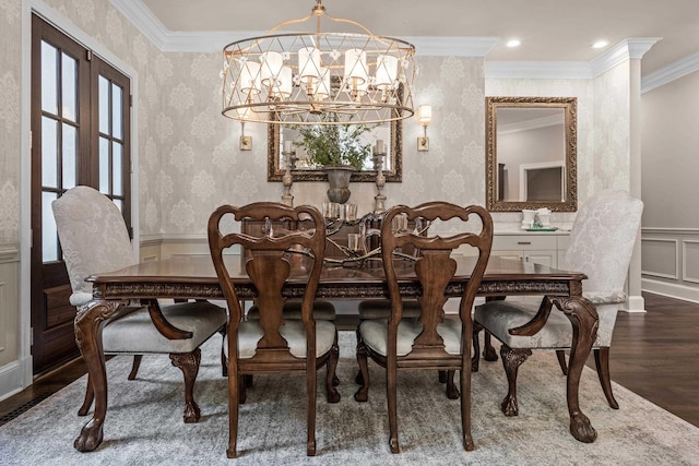 dining room with crown molding, dark hardwood / wood-style floors, and a notable chandelier