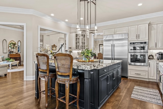 kitchen with stainless steel appliances, a center island, and white cabinets