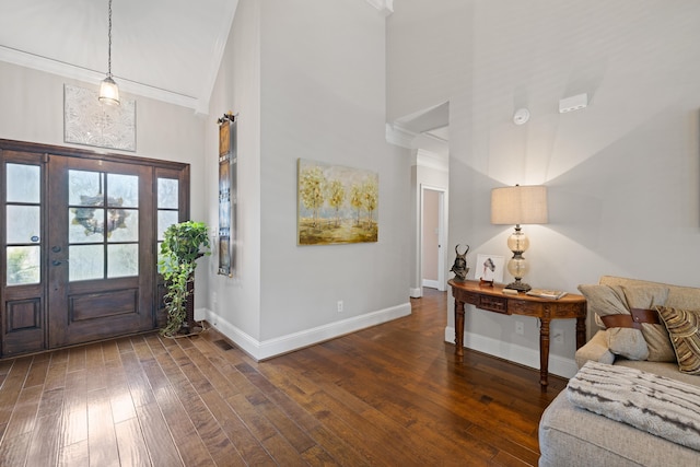 entryway with baseboards, high vaulted ceiling, and wood-type flooring