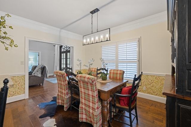 dining area featuring ornamental molding, dark wood-style flooring, wallpapered walls, and baseboards