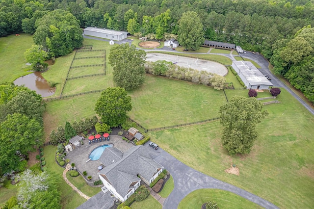 birds eye view of property with a wooded view