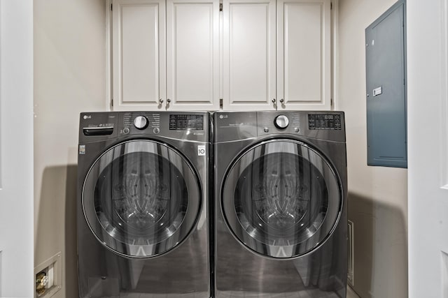 washroom with separate washer and dryer and cabinets