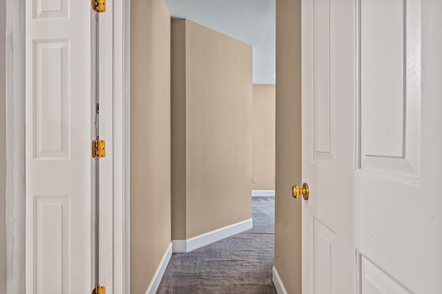 hallway featuring carpet flooring