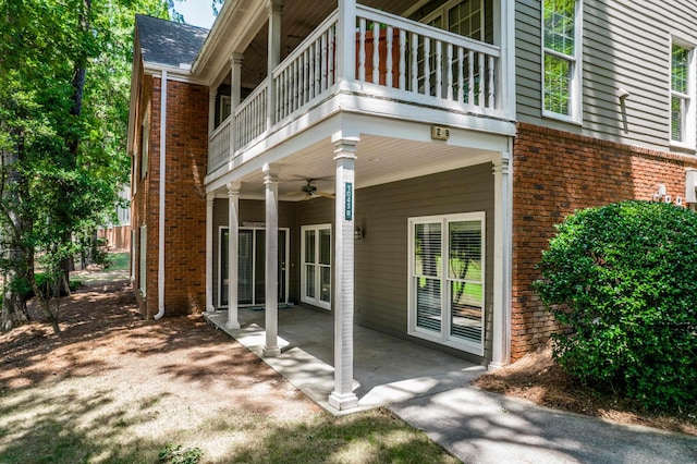 exterior space featuring a patio, a balcony, and ceiling fan