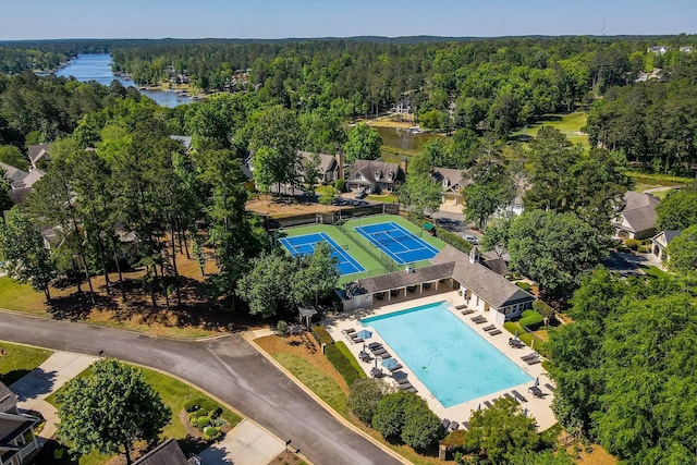 aerial view featuring a water view and a view of trees