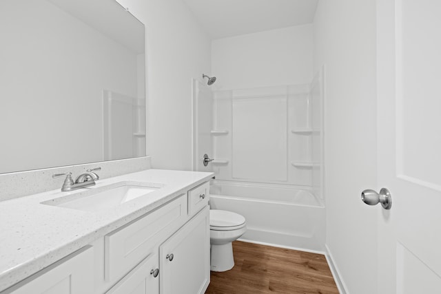 full bathroom with toilet, shower / bathtub combination, wood finished floors, and vanity