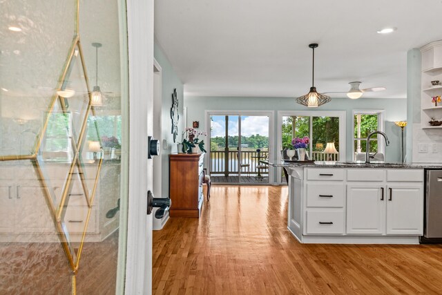 1601 Heidi Trl, Buckhead, GA 30625 - kitchen with healthy amount of natural light, a sink, white cabinets, light wood-type flooring, and recessed lighting