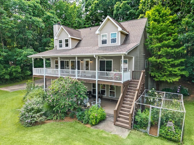 1601 Heidi Trl, Buckhead, GA 30625 - view of front of home with stairs, a chimney, a front lawn, a patio, and roof with shingles