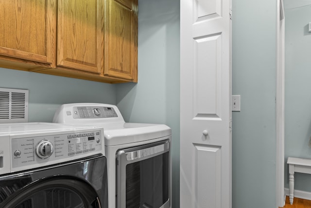 1601 Heidi Trl, Buckhead, GA 30625 - washroom with cabinet space and washing machine and dryer