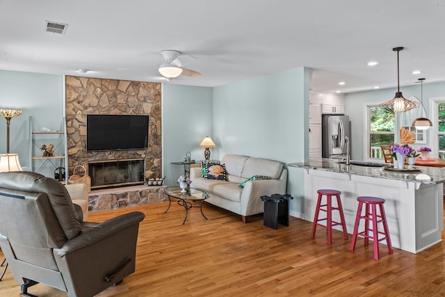 1601 Heidi Trl, Buckhead, GA 30625 - living room featuring ceiling fan, light wood-style flooring, a fireplace, and recessed lighting