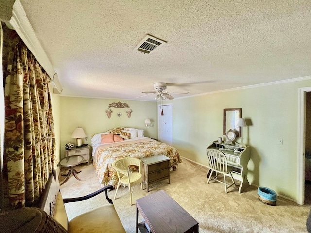 carpeted bedroom with crown molding, ceiling fan, and a textured ceiling