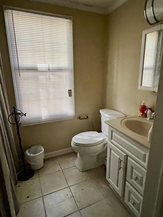 bathroom with vanity, tile patterned floors, and toilet