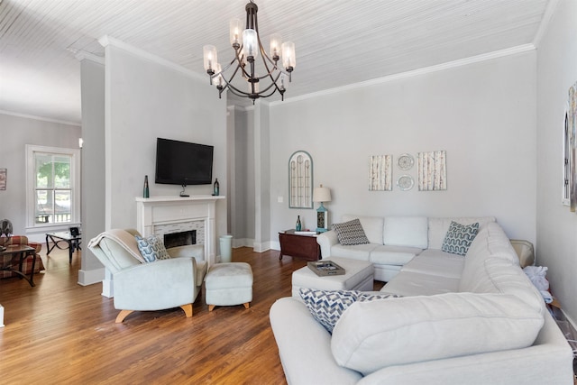 living room featuring ornamental molding, hardwood / wood-style floors, and a notable chandelier