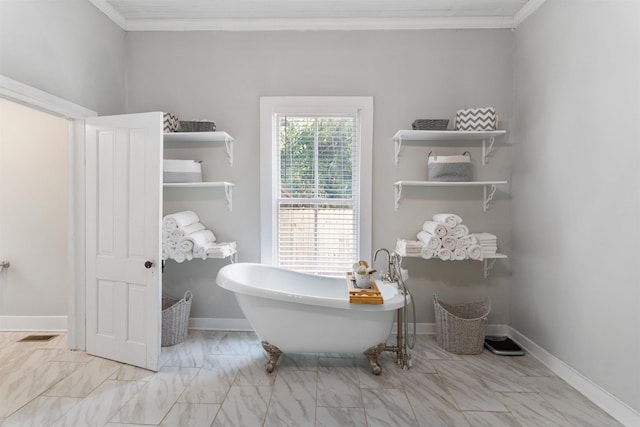 bathroom with a washtub and crown molding