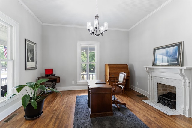 office space featuring an inviting chandelier, dark wood-type flooring, and ornamental molding