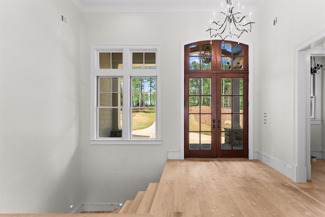 1111 Swift Crk, Greensboro, GA 30642 - entryway with french doors, a chandelier, plenty of natural light, and baseboards