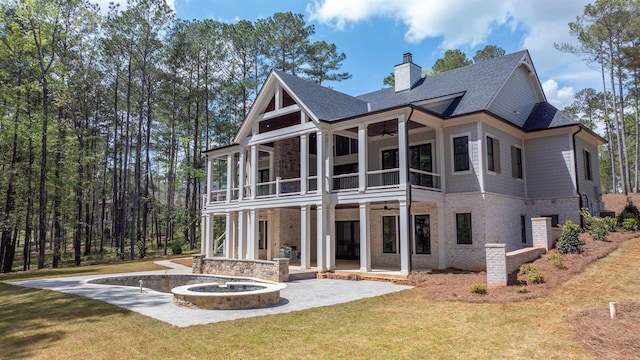 1111 Swift Crk, Greensboro, GA 30642 - back of property featuring a ceiling fan, a balcony, a lawn, a patio area, and a chimney