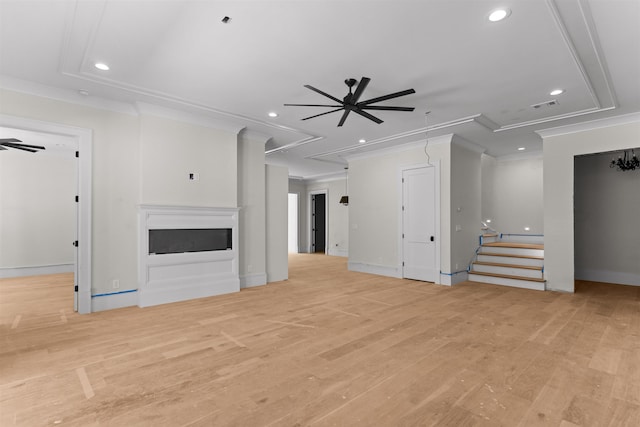 1111 Swift Crk, Greensboro, GA 30642 - unfurnished living room featuring ceiling fan, recessed lighting, light wood finished floors, crown molding, and a fireplace