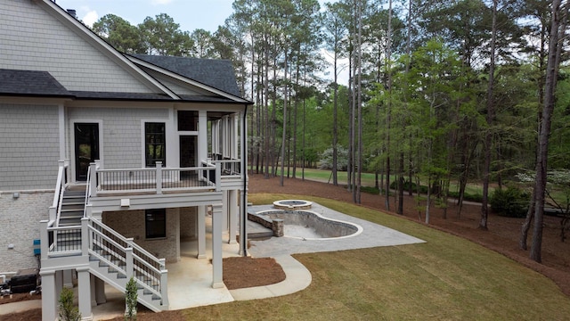 1111 Swift Crk, Greensboro, GA 30642 - view of grassy yard featuring stairs, a patio area, an outdoor fire pit, and a wooden deck