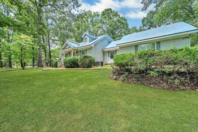 view of front of home featuring central AC and a front yard