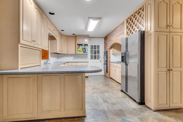 kitchen featuring light brown cabinetry, sink, stainless steel fridge with ice dispenser, kitchen peninsula, and black double oven